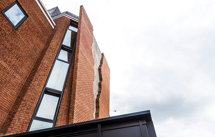 Take a look at this ripped brick facade by Alex Chinneck