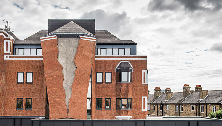 Take a look at this ripped brick facade by Alex Chinneck